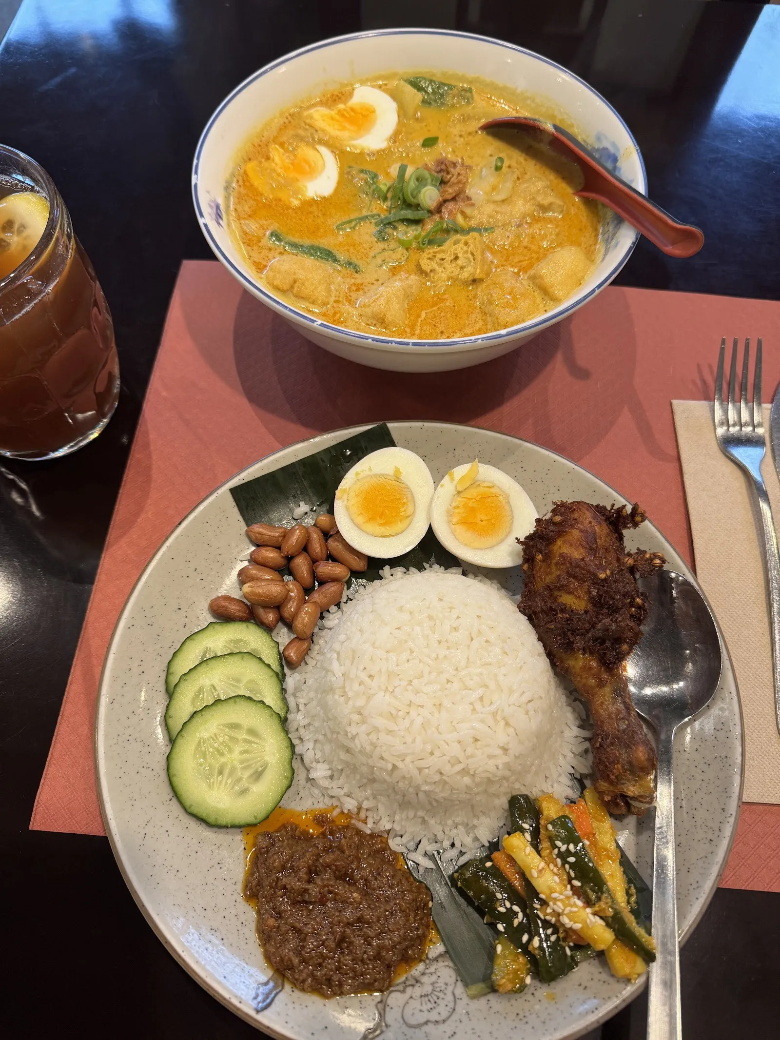 Nasi lemak and laksa served at the table