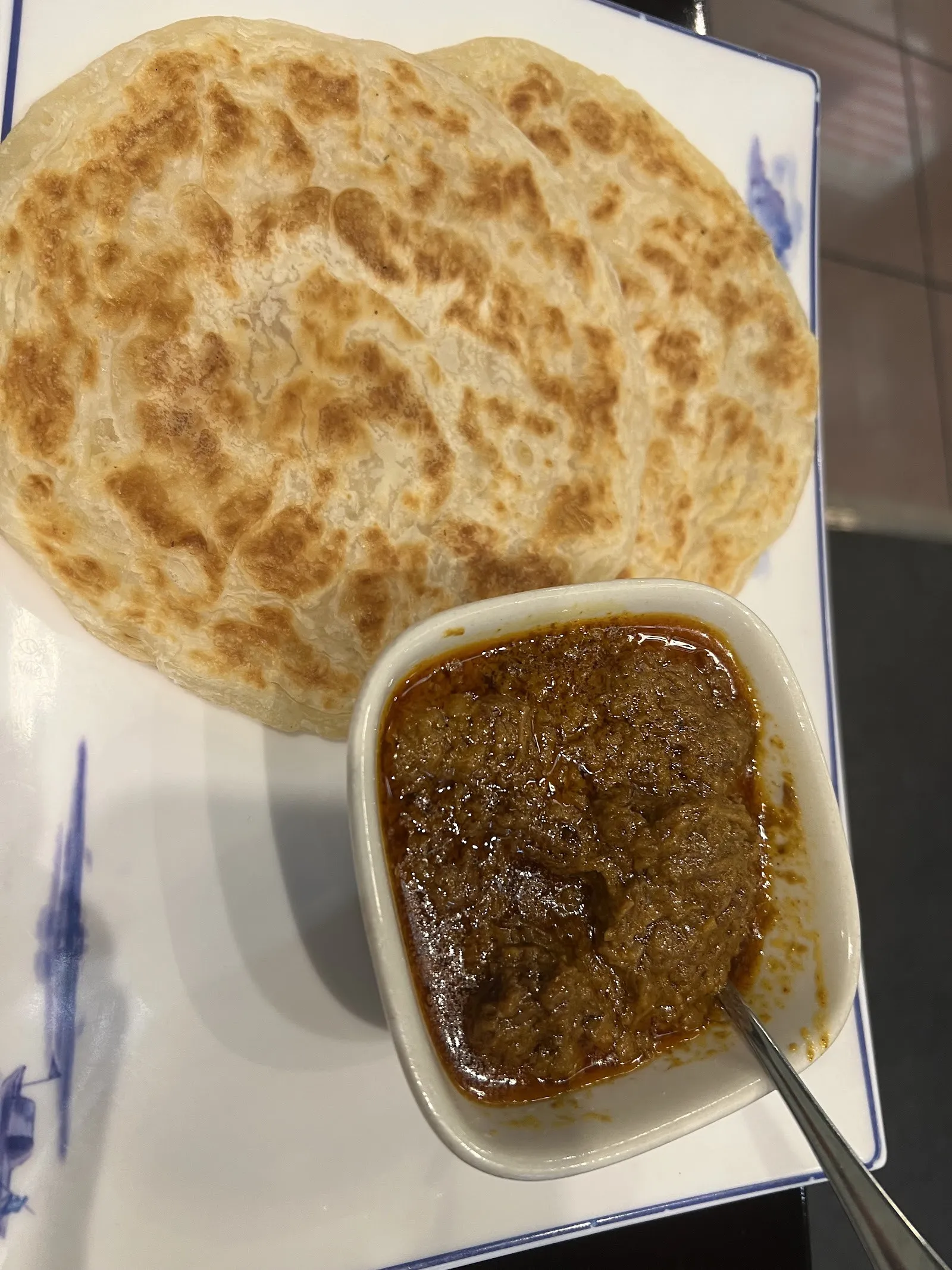 Roti canai with curry
